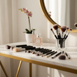Load image into Gallery viewer, a makeup brush bundle laying on a vanity. Brushes should have a silver ferrule and a black wooden handle with no words on the brushes
